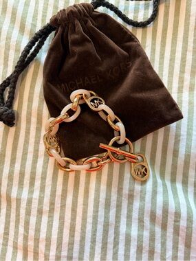 Michael Kors Gold and blush pink Link Toggle Bracelet with MK Charms